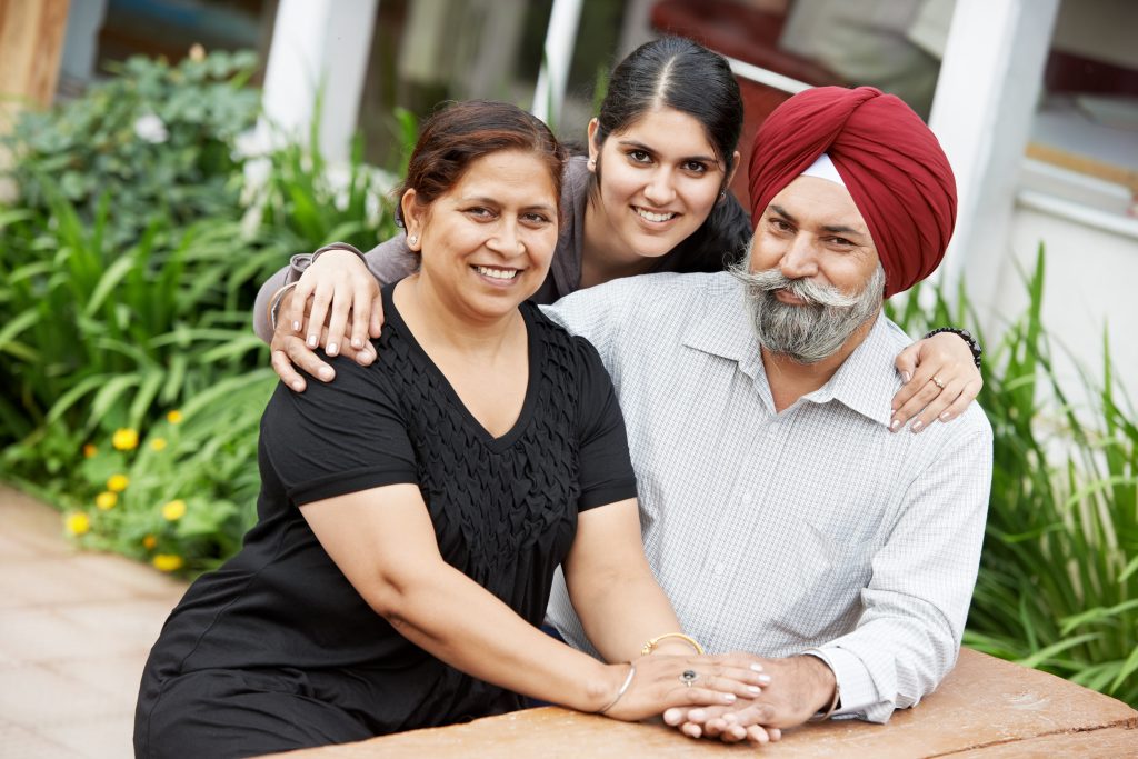 Happy Smiling indian sikh adult people family outdoors